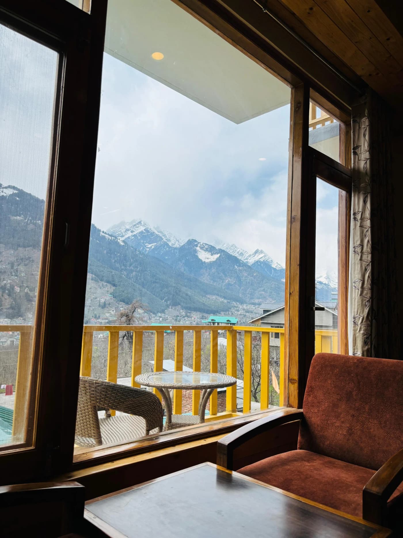 Room balcony with snow mountain panorama at Hotel Green Valley, Manali